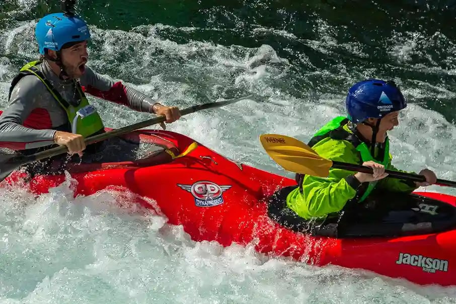 kayakers navigating a whitewater river